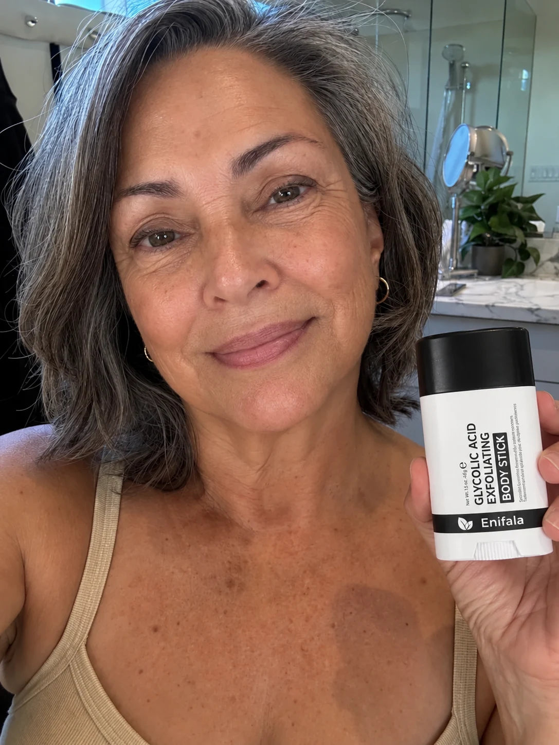Customer holding the Smooth & Even Glycolic Body Stick