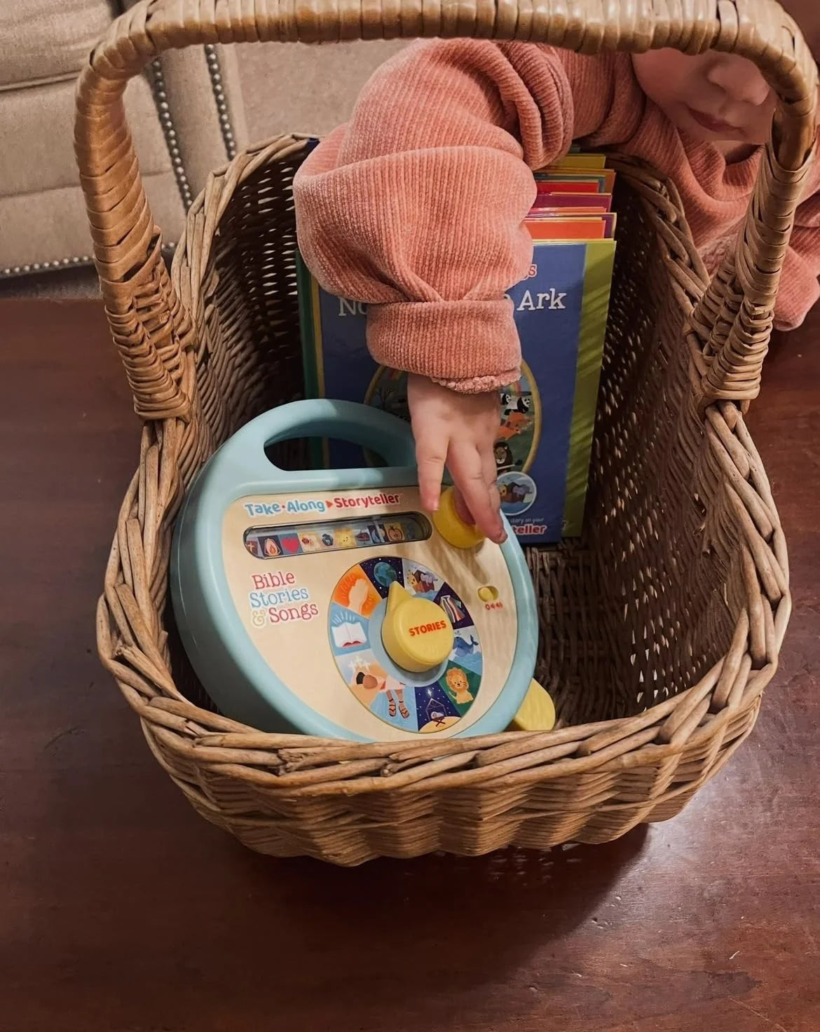 Child choosing a story on the Bible story and song player